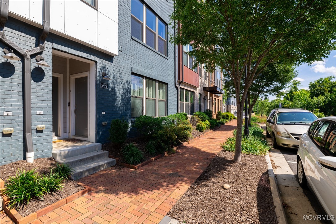5329 Old Main Street, Unit A Henrico, VA 23231 - Photo 35 of 39 a view of a patio with couches table and chairs and potted plants