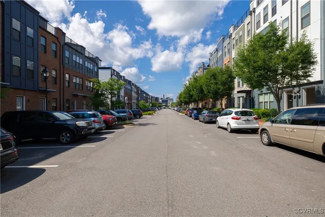 a view of a brick building next to a yard