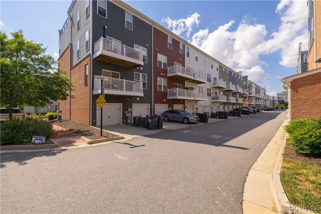 a view of street with parked cars