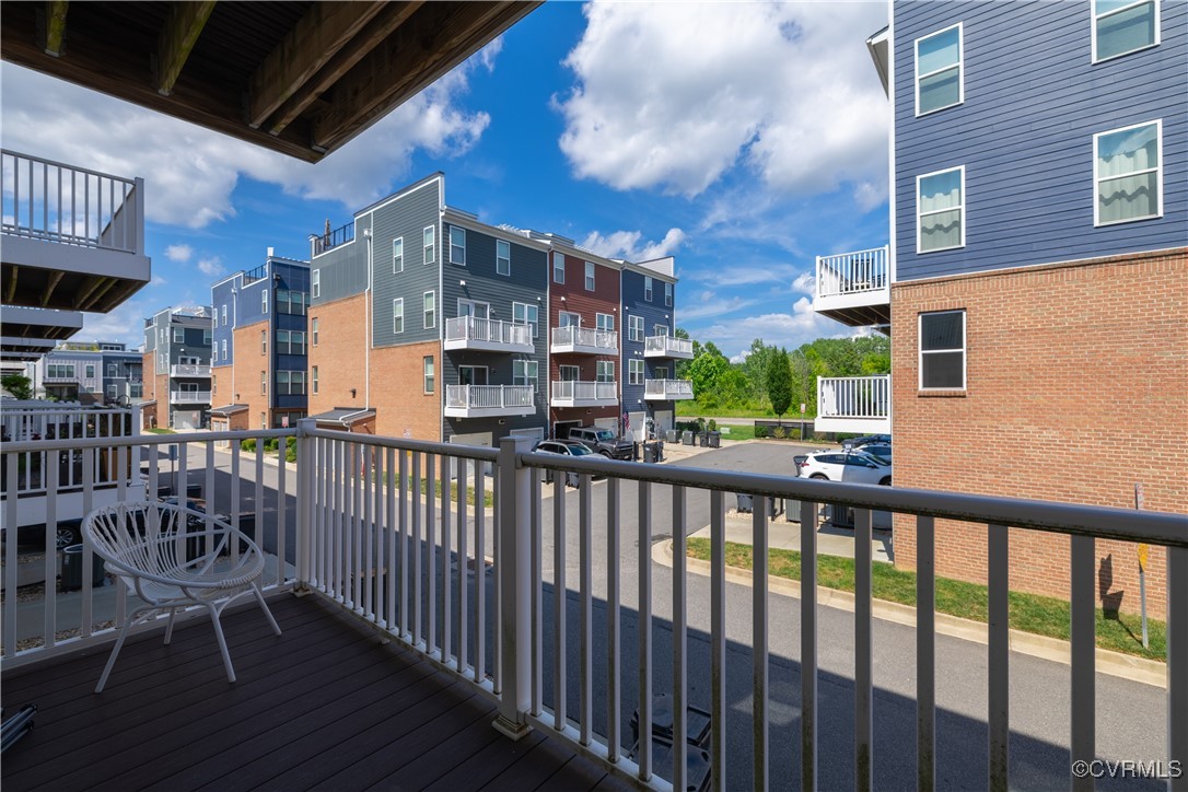 5329 Old Main Street, Unit A Henrico, VA 23231 - Photo 5 of 39 a view of a balcony with a large window and wooden fence