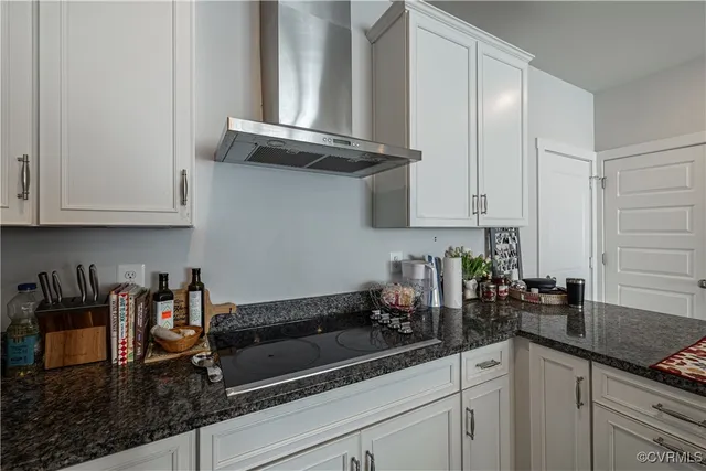 a kitchen with a sink dishwasher and cabinets