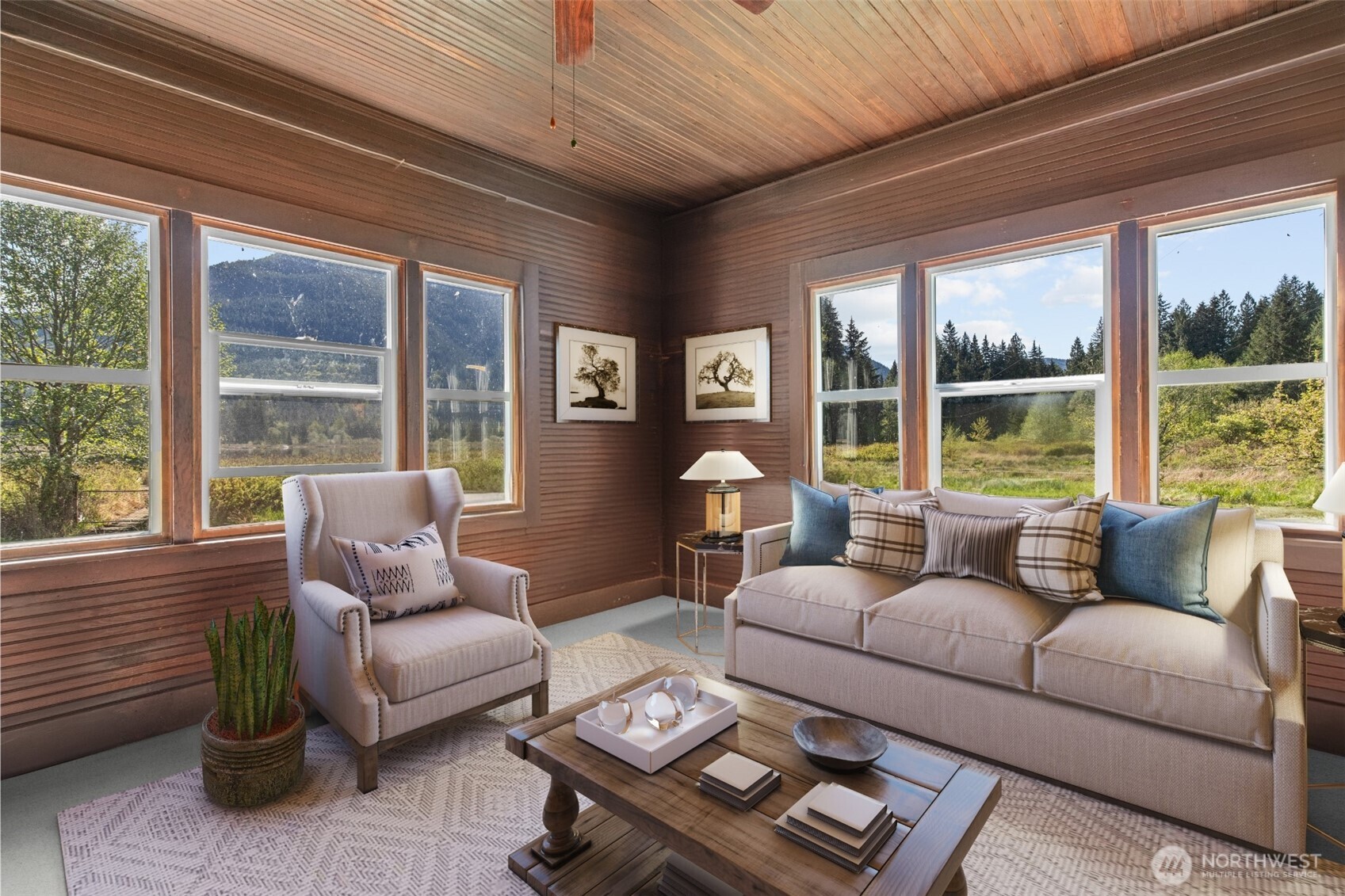 27525 West Lake Riley Road Arlington, WA 98223 - Photo 15 of 40 a living room with furniture and a large window