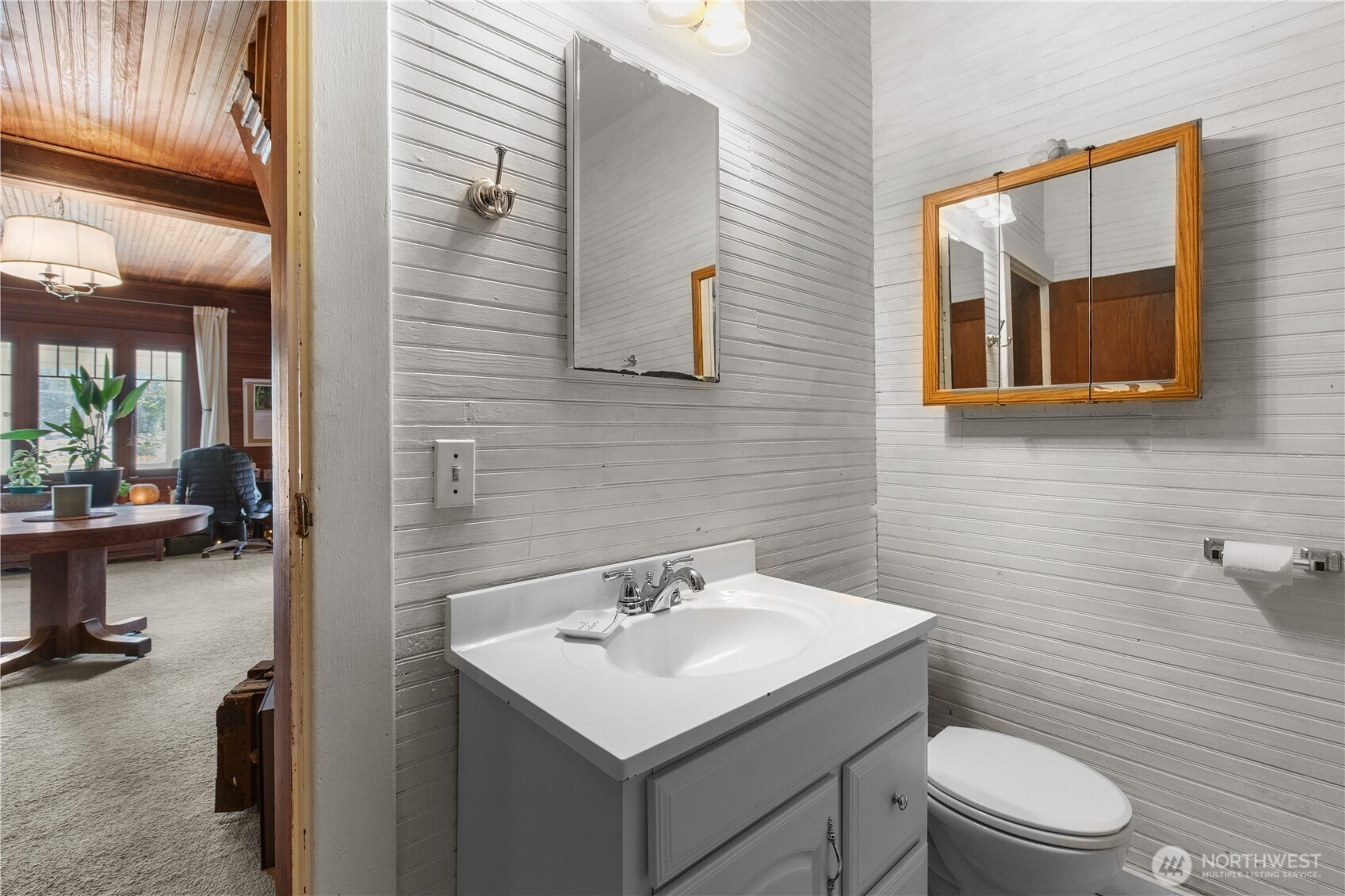 27525 West Lake Riley Road Arlington, WA 98223 - Photo 20 of 40 a bathroom with a toilet a sink and a mirror