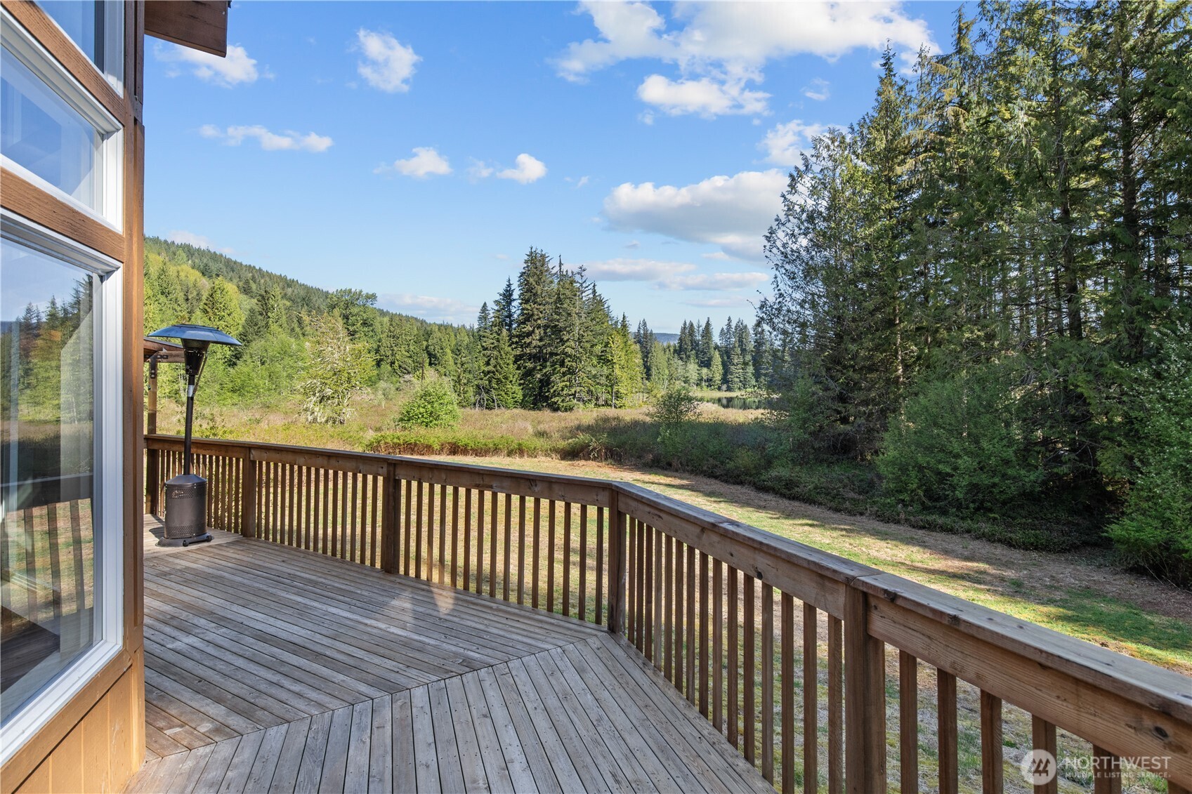27525 West Lake Riley Road Arlington, WA 98223 - Photo 25 of 40 a view of a balcony with wooden floor
