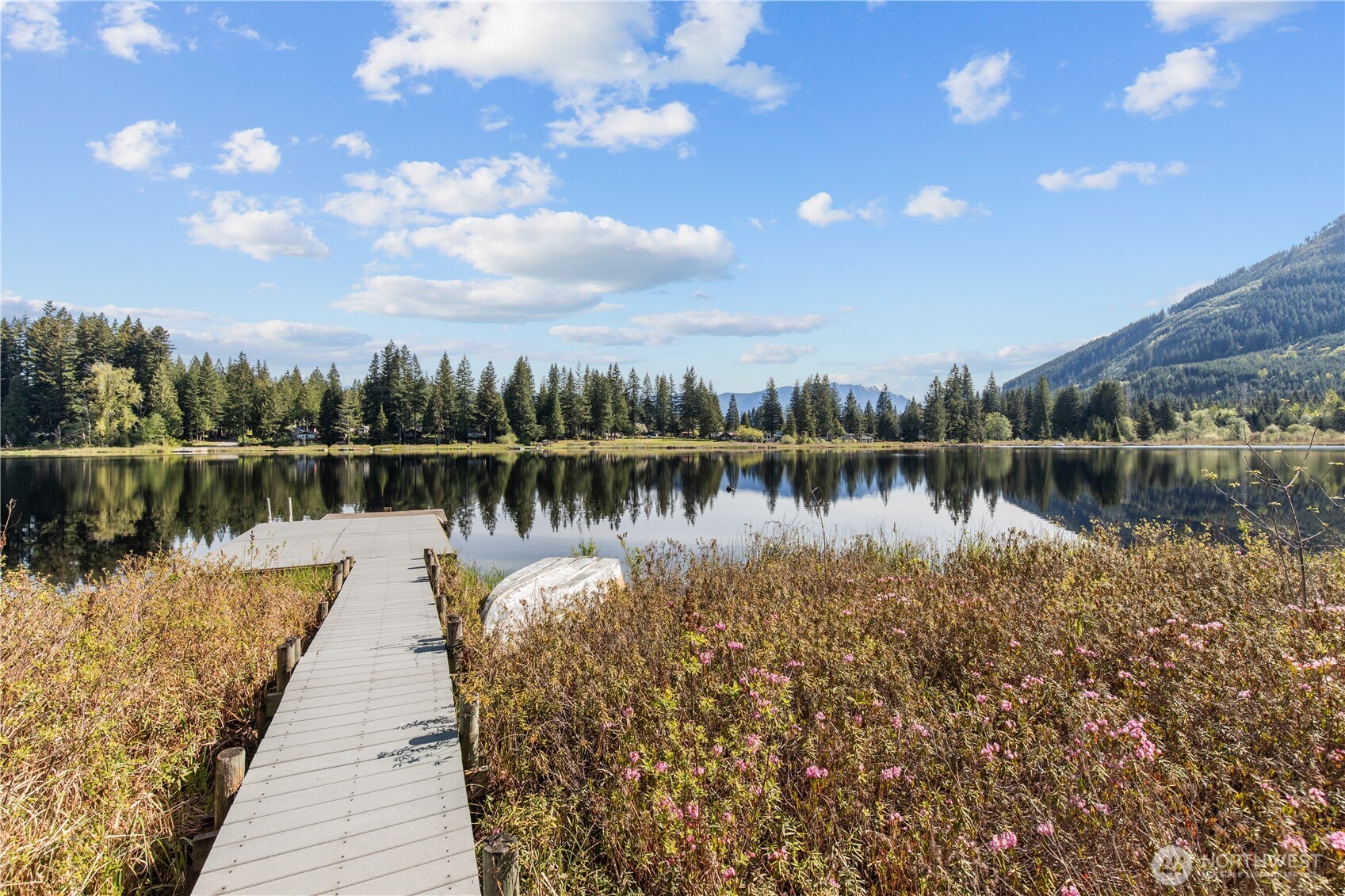 27525 West Lake Riley Road Arlington, WA 98223 - Photo 27 of 40 a lake view with boat and large trees