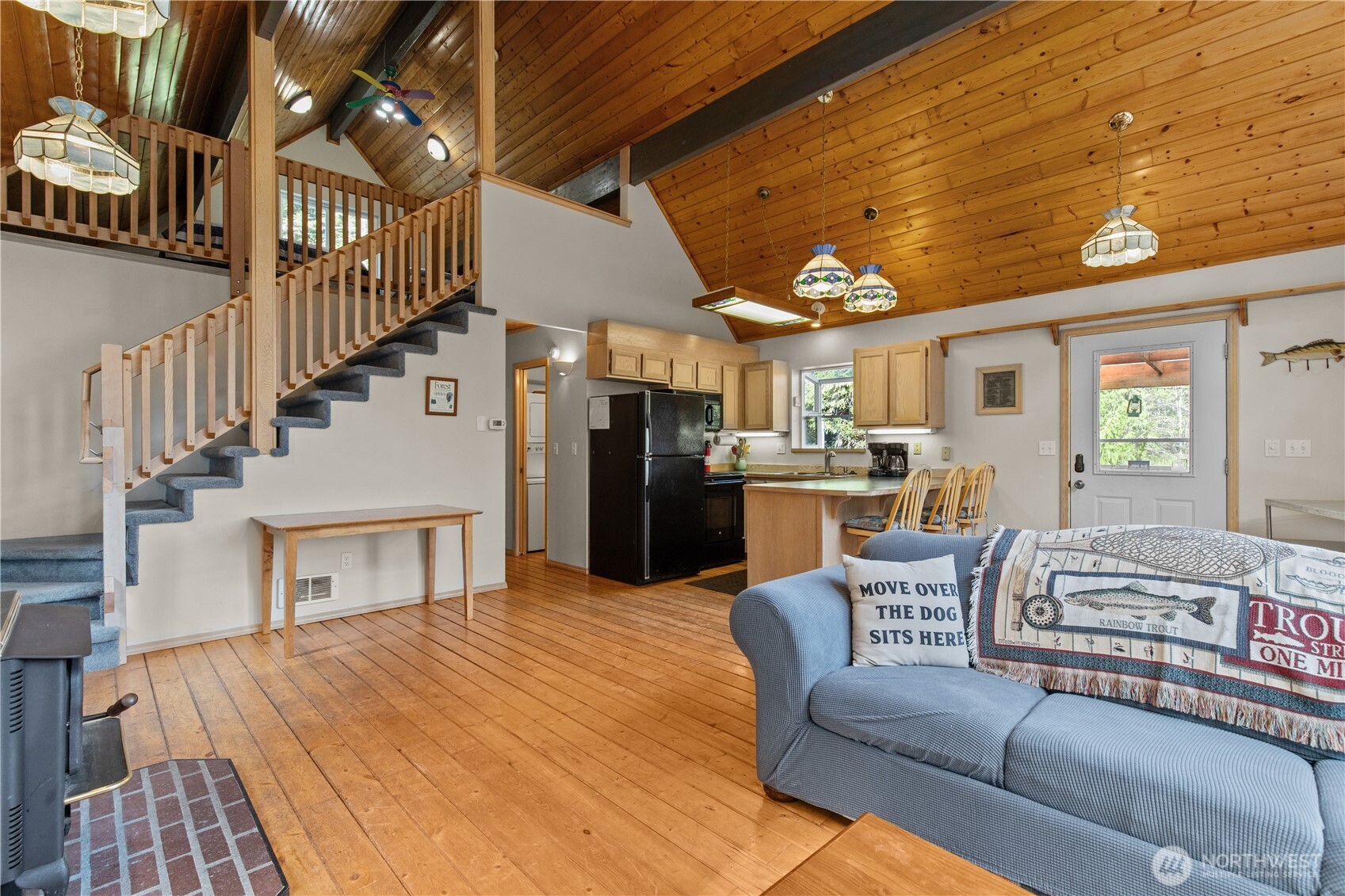 27525 West Lake Riley Road Arlington, WA 98223 - Photo 29 of 40 a living room with furniture fireplace and dining room
