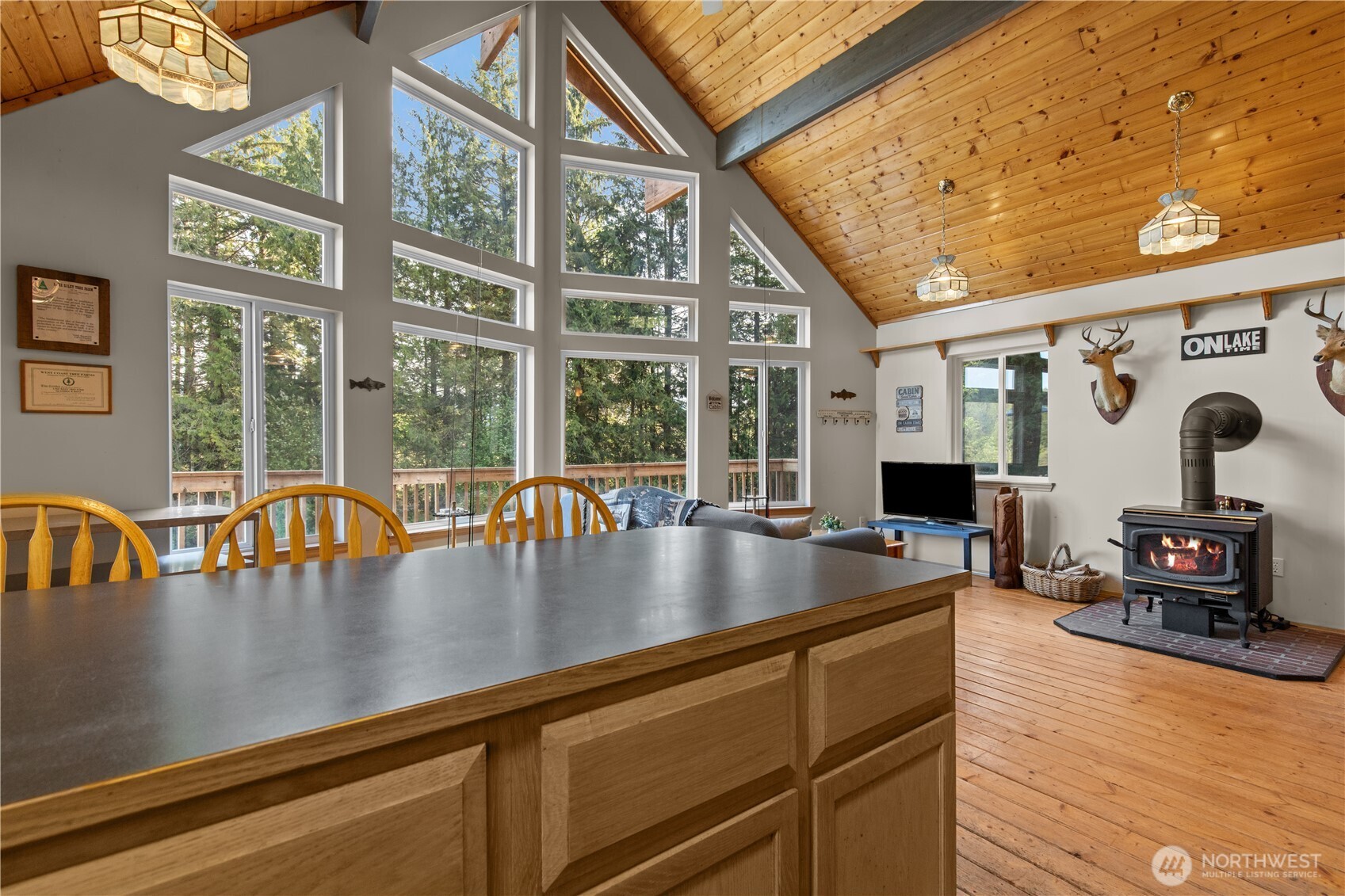 27525 West Lake Riley Road Arlington, WA 98223 - Photo 30 of 40 a view of living room with furniture and floor to ceiling windows
