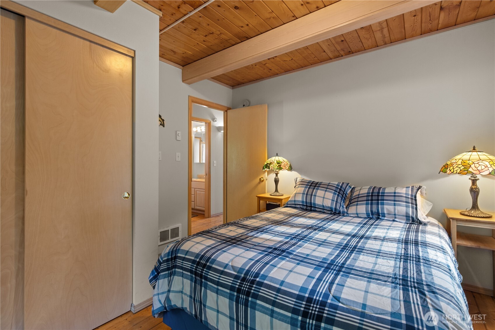 27525 West Lake Riley Road Arlington, WA 98223 - Photo 32 of 40 a bedroom with a bed and a window