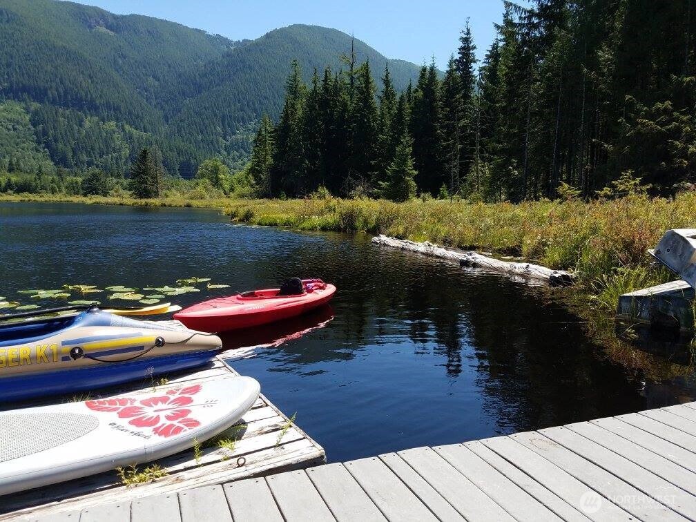 27525 West Lake Riley Road Arlington, WA 98223 - Photo 38 of 40 a view of a balcony with two chairs and a table
