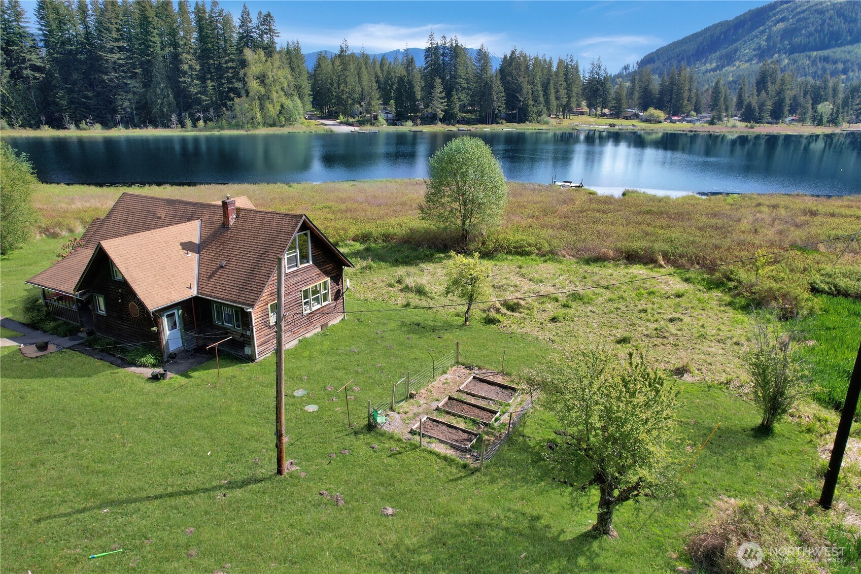 27525 West Lake Riley Road Arlington, WA 98223 - Photo 5 of 40 a view of a lake with sitting area