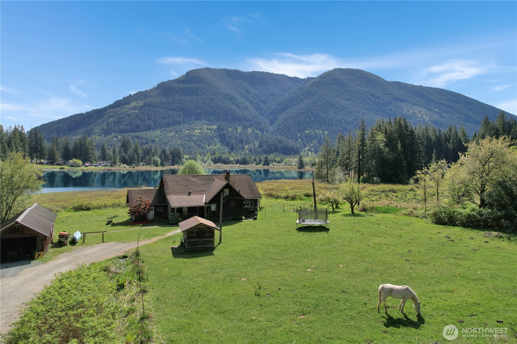 27525 West Lake Riley Road Arlington, WA 98223 - Photo 8 of 40 a view of a garden with sitting area