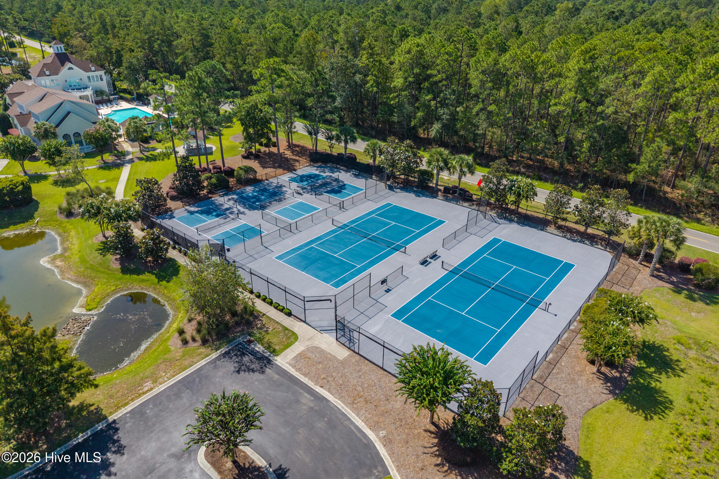 607 River Ridge Road, Unit 1 Shallotte, NC 28470 - Photo 51 of 58 Community amenities include an 18-hole championship golf course, oceanfront clubhouse, swimming pool, tennis facilities, and scenic walking trails.