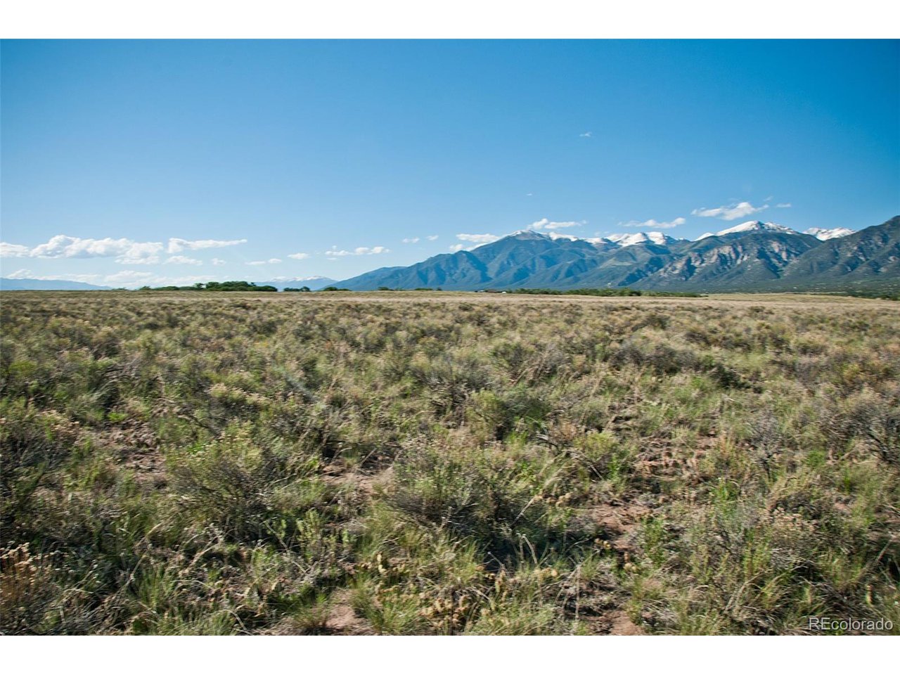 620 Pine Cone Road Crestone, CO 81131 - Photo 2 of 5 a view of a room with an ocean and mountain view