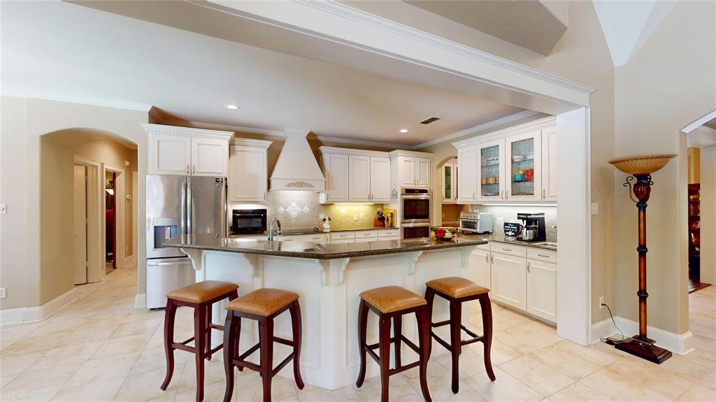 7451 County Road 1509 Athens, TX 75751 - Photo 5 of 36 a kitchen with stainless steel appliances granite countertop table chairs sink and cabinets