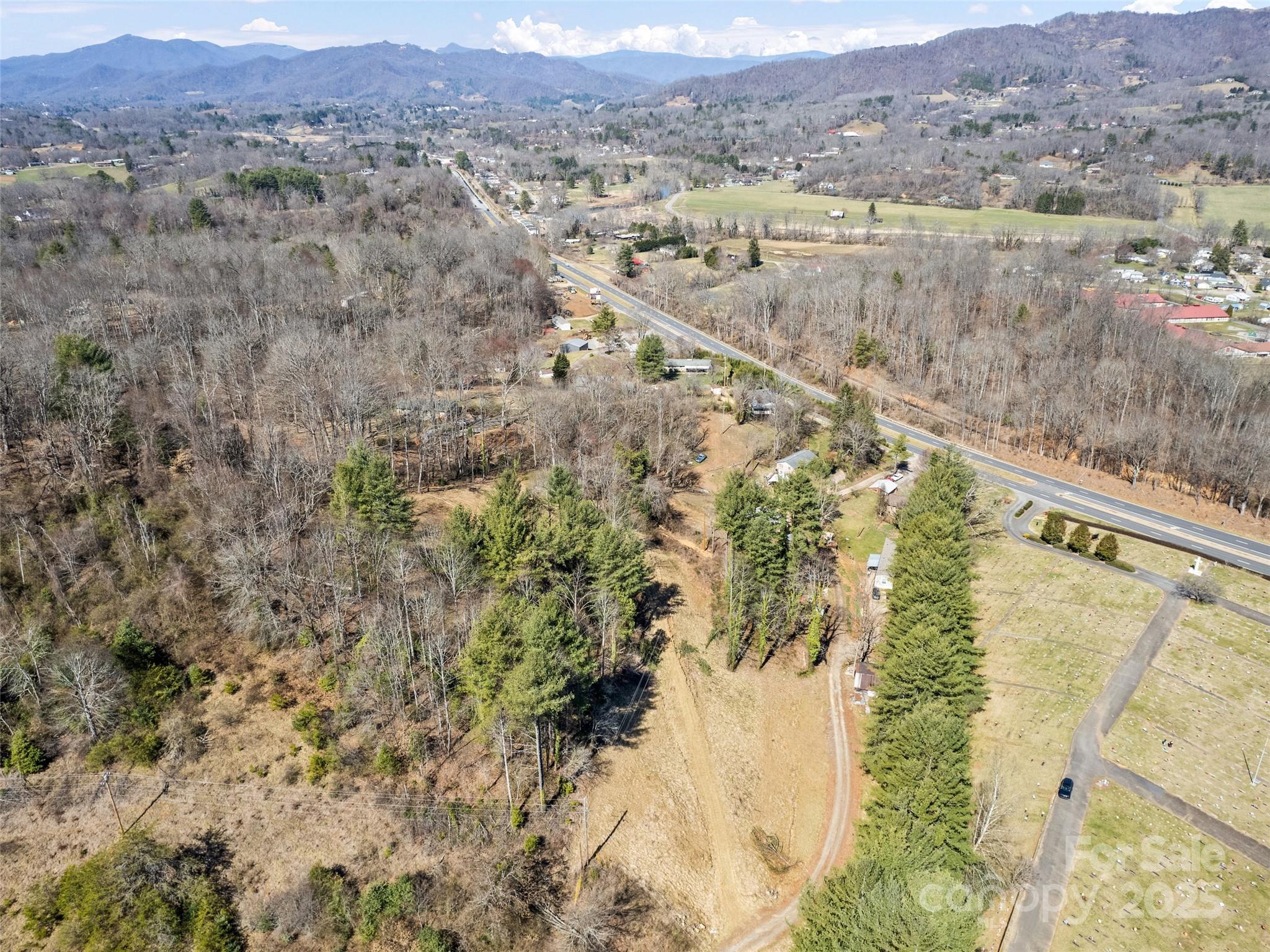 157 Harveys Mountain Road Clyde, NC 28721 - Photo 5 of 16 a view of a lake in middle of the forest
