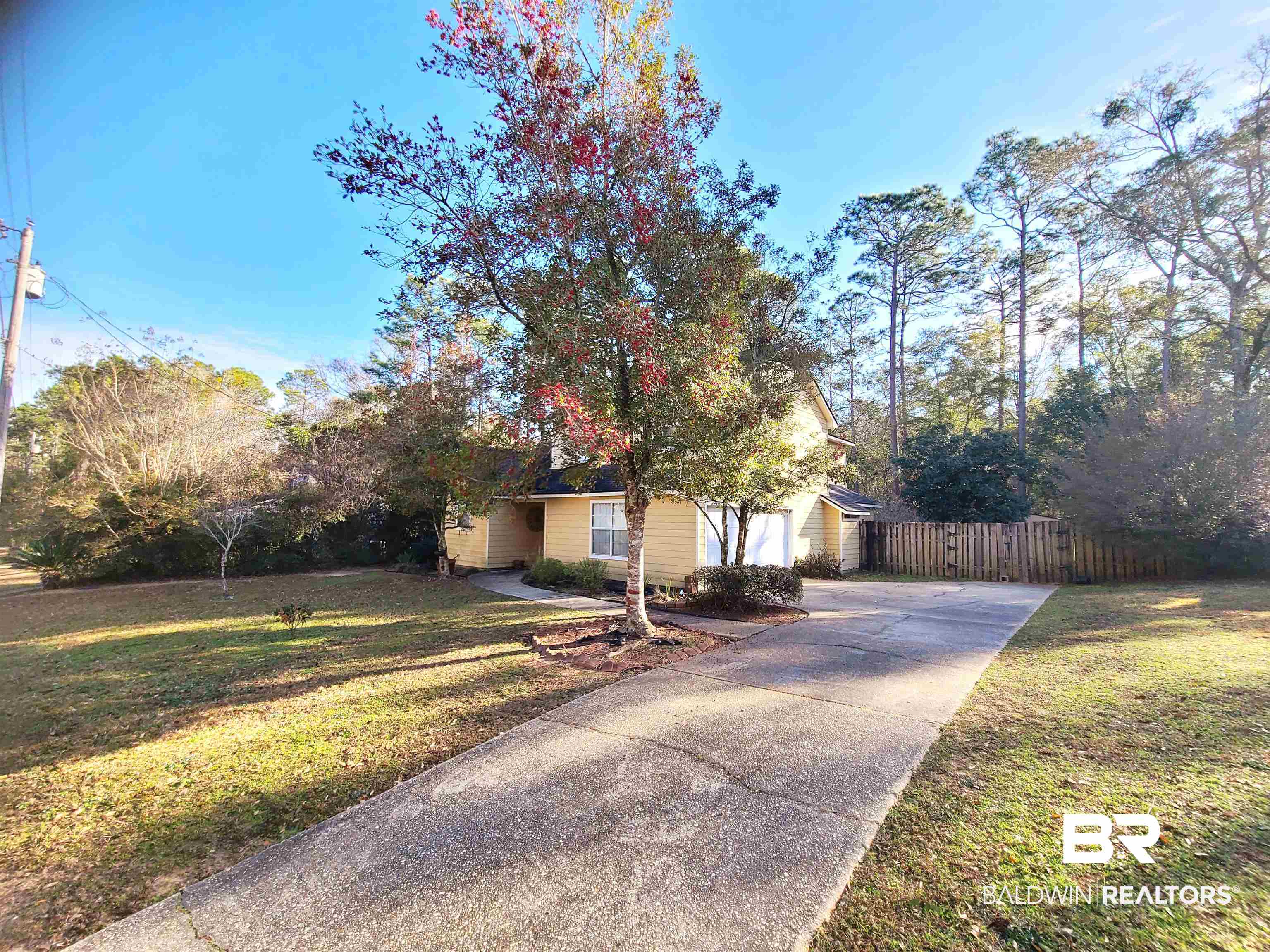 123 Melanie Loop Daphne, AL 36526 - Photo 2 of 17 View of front facade featuring driveway