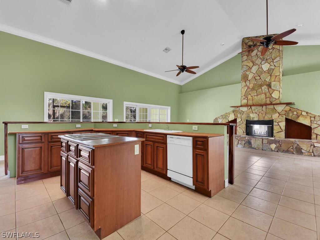 20401 Carter Road Estero, FL 33928 - Photo 11 of 42 a kitchen with stainless steel appliances granite countertop a stove and a wooden cabinets