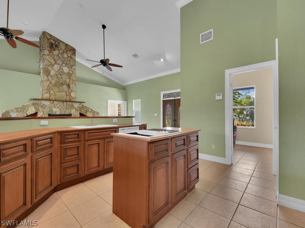 20401 Carter Road Estero, FL 33928 - Photo 13 of 42 a kitchen with a stove and a sink