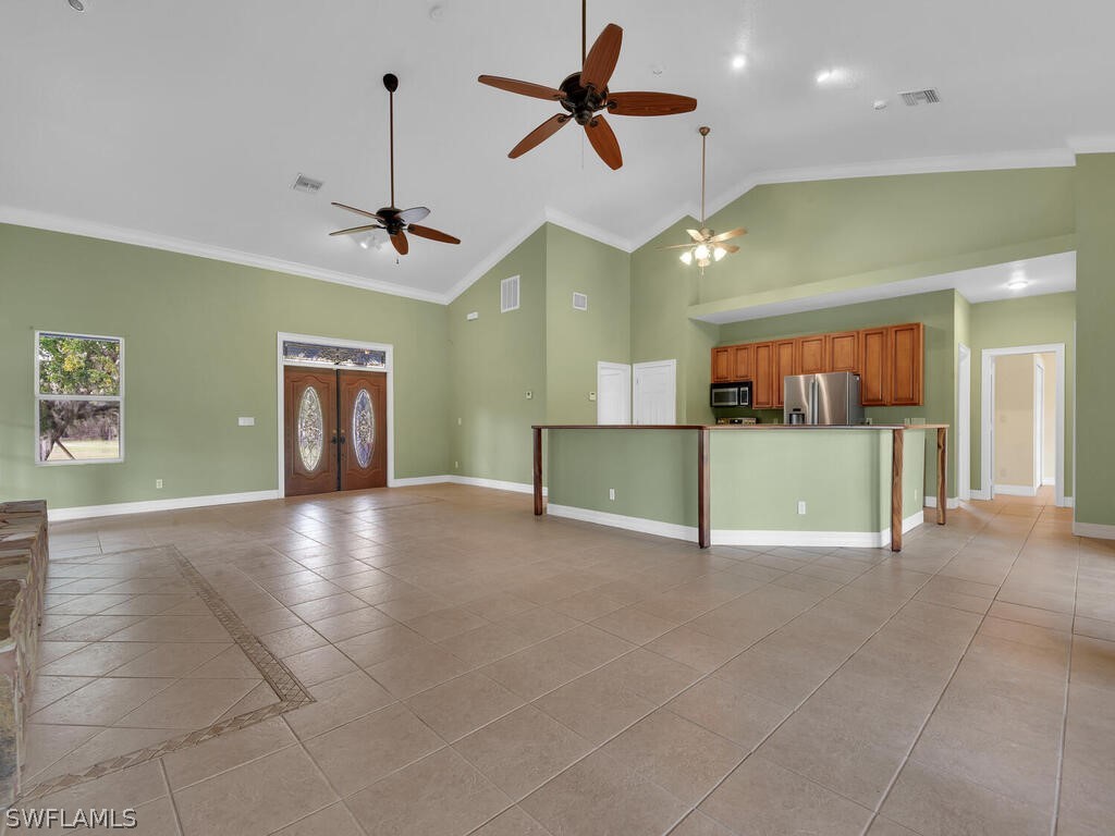 20401 Carter Road Estero, FL 33928 - Photo 14 of 42 a view of a kitchen with a sink and a chandelier fan