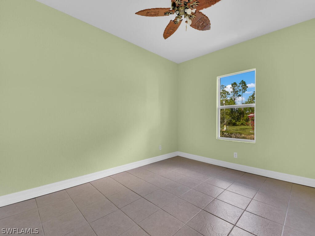20401 Carter Road Estero, FL 33928 - Photo 26 of 42 a view of an empty room with a window
