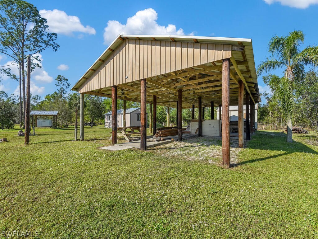 20401 Carter Road Estero, FL 33928 - Photo 30 of 42 a view of a house with backyard and sitting area