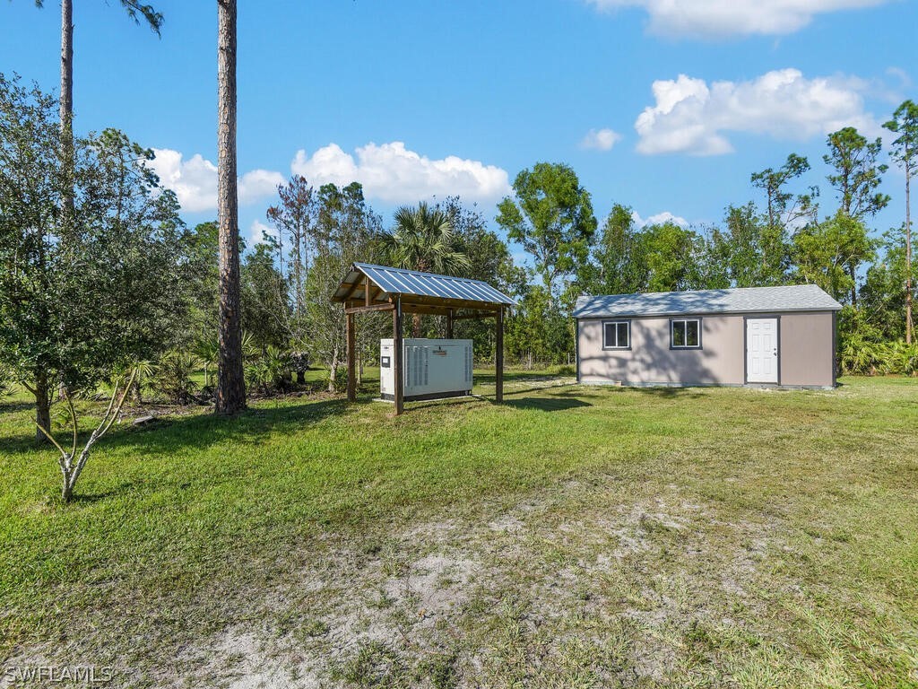 20401 Carter Road Estero, FL 33928 - Photo 31 of 42 a front view of a house with garden