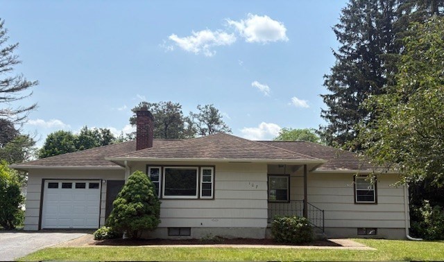 a front view of a house with yard