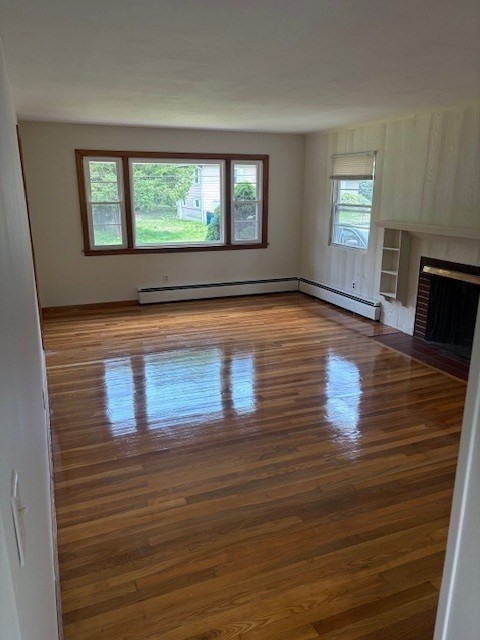 107 Valley Road Springfield, MA 01119 - Photo 2 of 14 a view of empty room with window and wooden floor