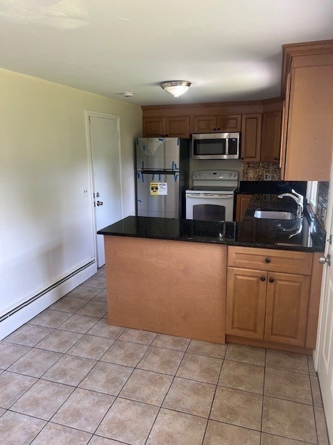 107 Valley Road Springfield, MA 01119 - Photo 4 of 14 a kitchen with stainless steel appliances granite countertop a sink and cabinets