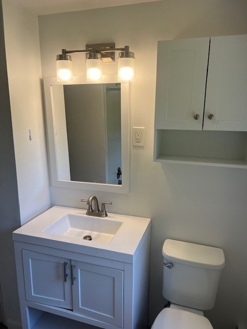 107 Valley Road Springfield, MA 01119 - Photo 5 of 14 a bathroom with a sink toilet and mirror