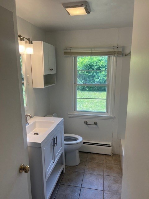 107 Valley Road Springfield, MA 01119 - Photo 6 of 14 a bathroom with a toilet sink and window