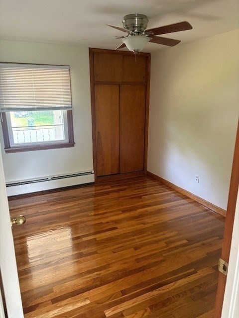 107 Valley Road Springfield, MA 01119 - Photo 9 of 14 an empty room with wooden floor closet and windows