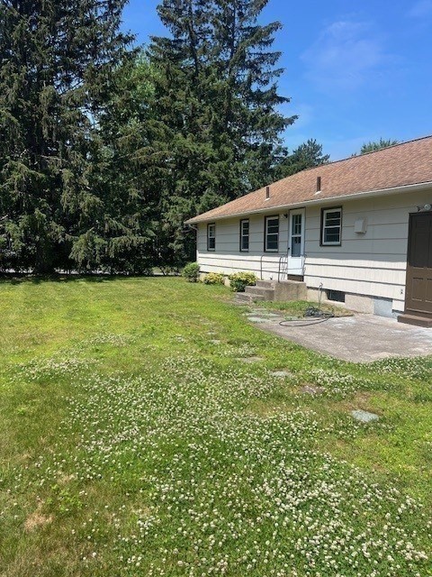 107 Valley Road Springfield, MA 01119 - Photo 10 of 14 a backyard of a house with table and chairs