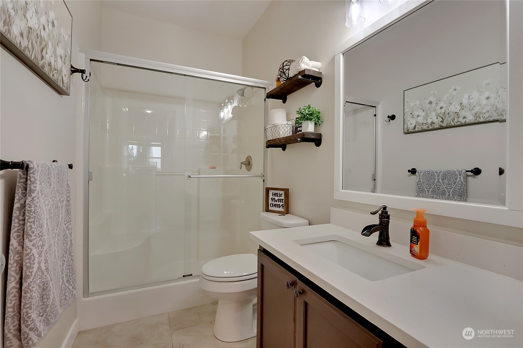 16004 24th Street East Lake Tapps, WA 98391 - Photo 14 of 32 a bathroom with a sink a toilet and shower