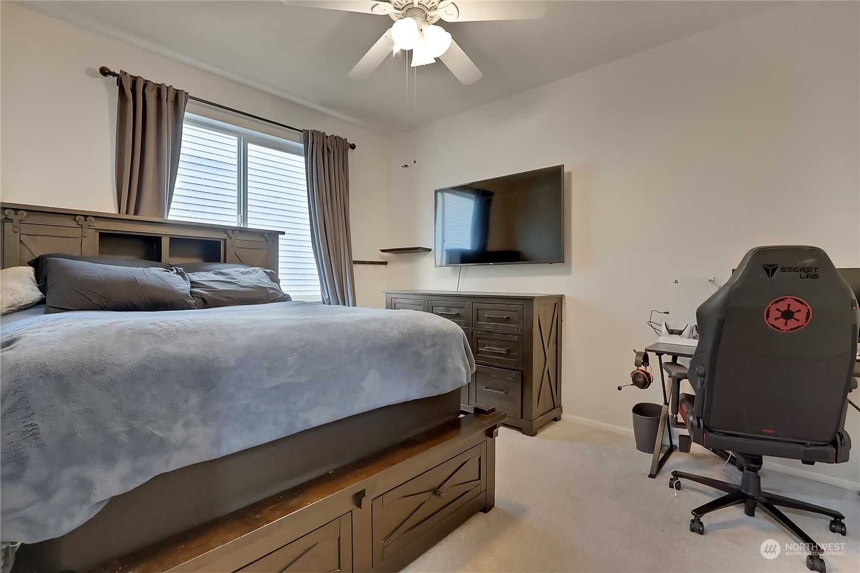 16004 24th Street East Lake Tapps, WA 98391 - Photo 19 of 32 a bedroom with a bed and a television