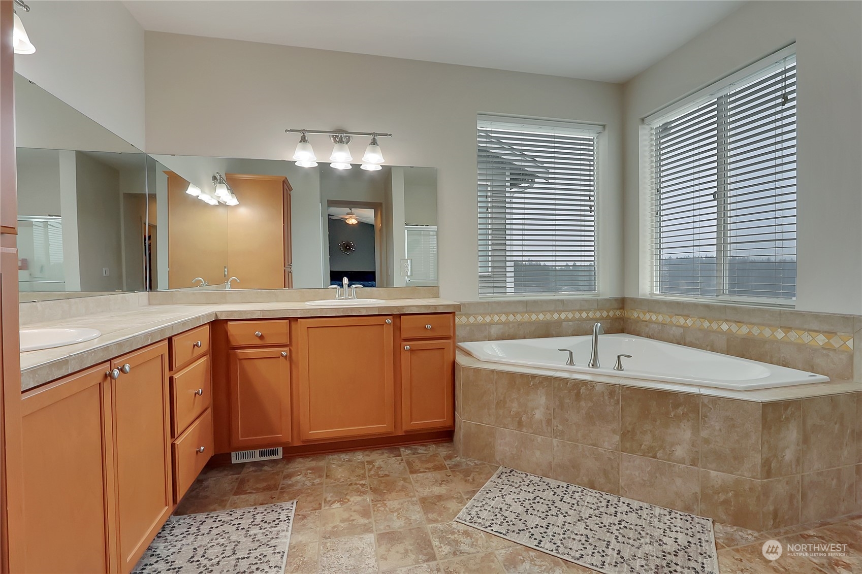 16004 24th Street East Lake Tapps, WA 98391 - Photo 24 of 32 a spacious bathroom with a tub sink and mirror