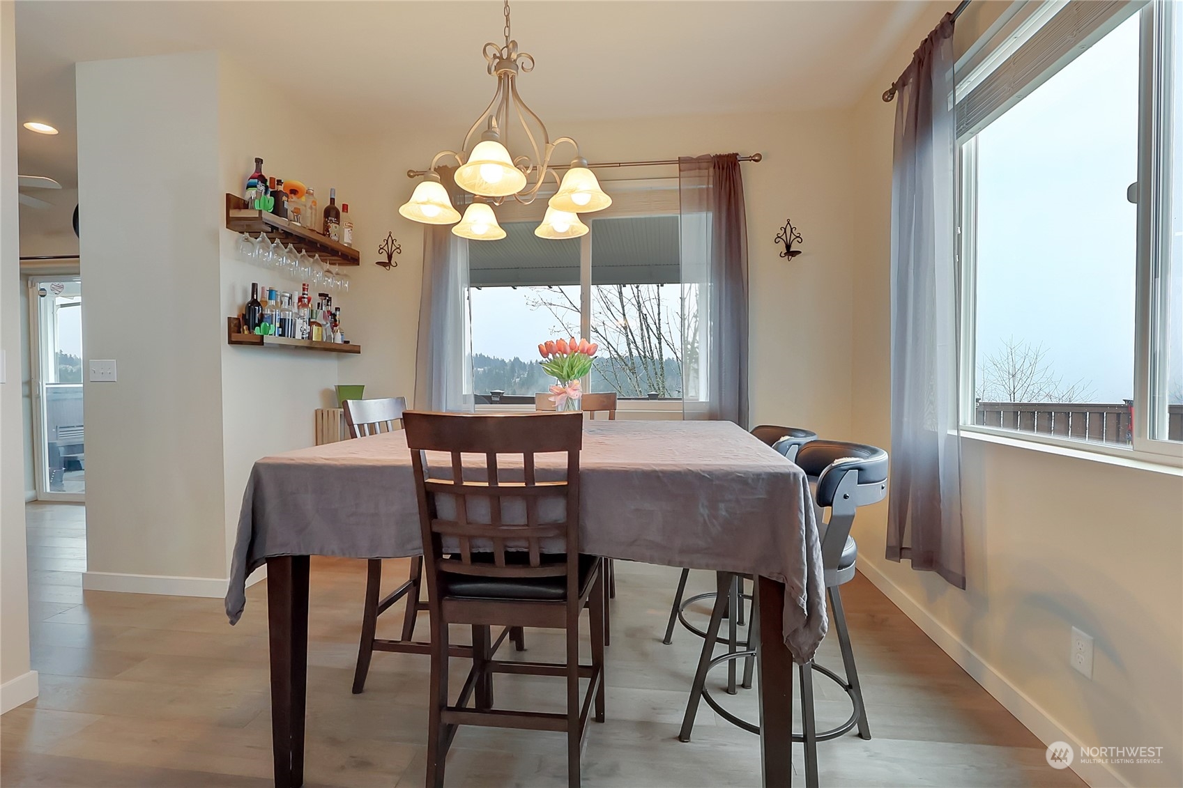 16004 24th Street East Lake Tapps, WA 98391 - Photo 7 of 32 a dining room with furniture a chandelier and window