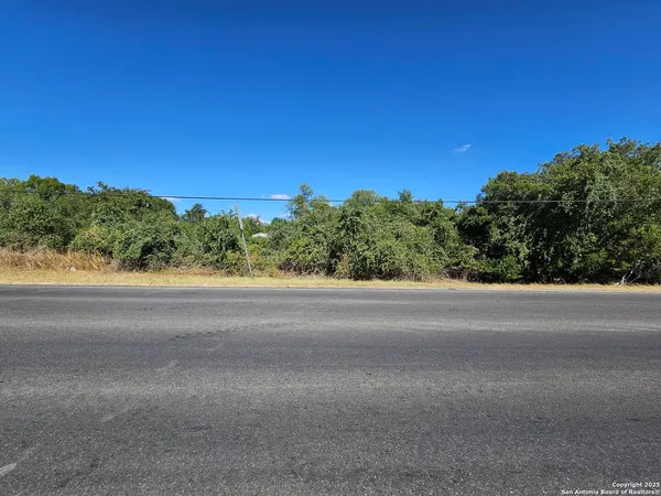 a view of a road with a yard