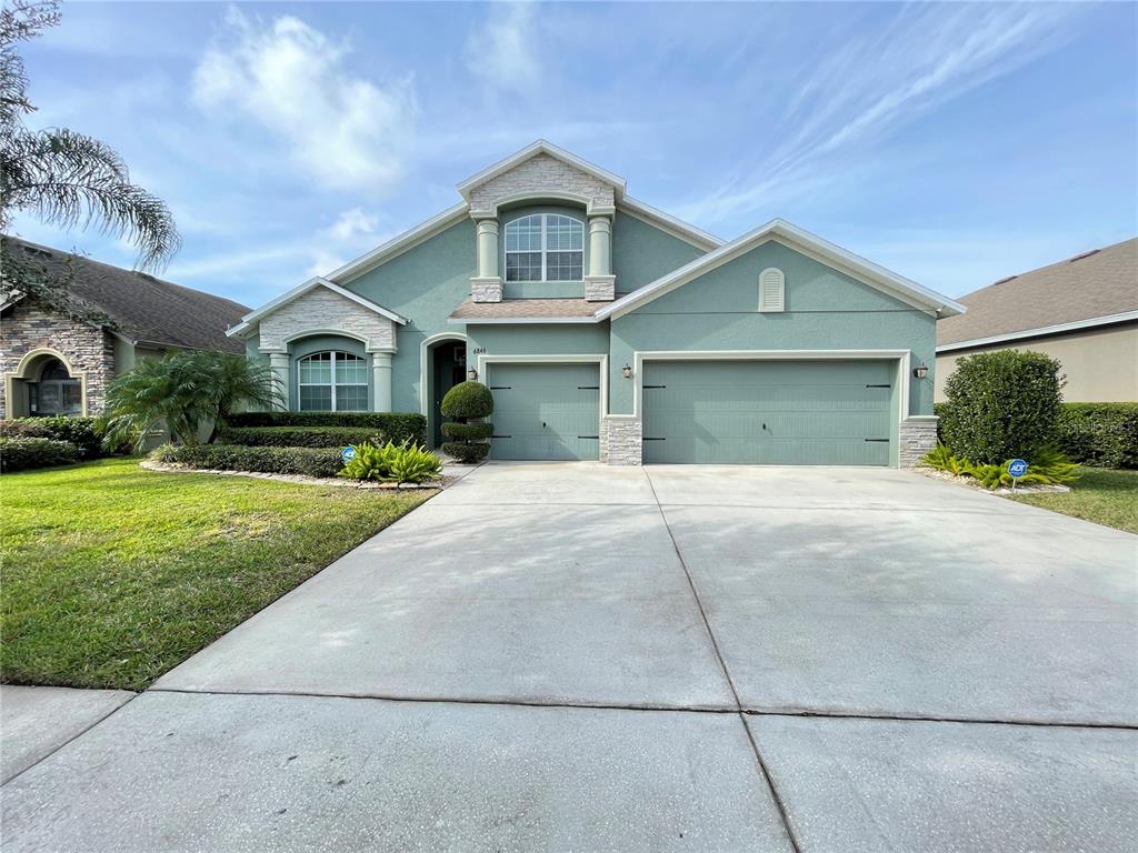 6846 Boulder Run Loop Wesley Chapel, FL 33545 - Photo 1 of 1 front view of a house with a yard