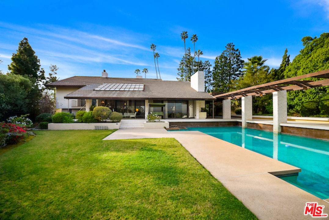 984 North Alpine Drive Beverly Hills, CA 90210 - Photo 8 of 8 a view of a house with a yard porch and sitting area