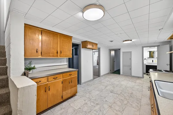 a spacious bathroom with a sink a mirror and a bathtub