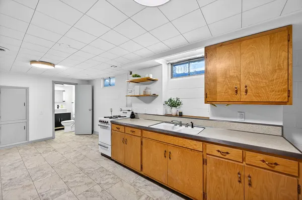 a kitchen with stainless steel appliances granite countertop a sink and cabinets