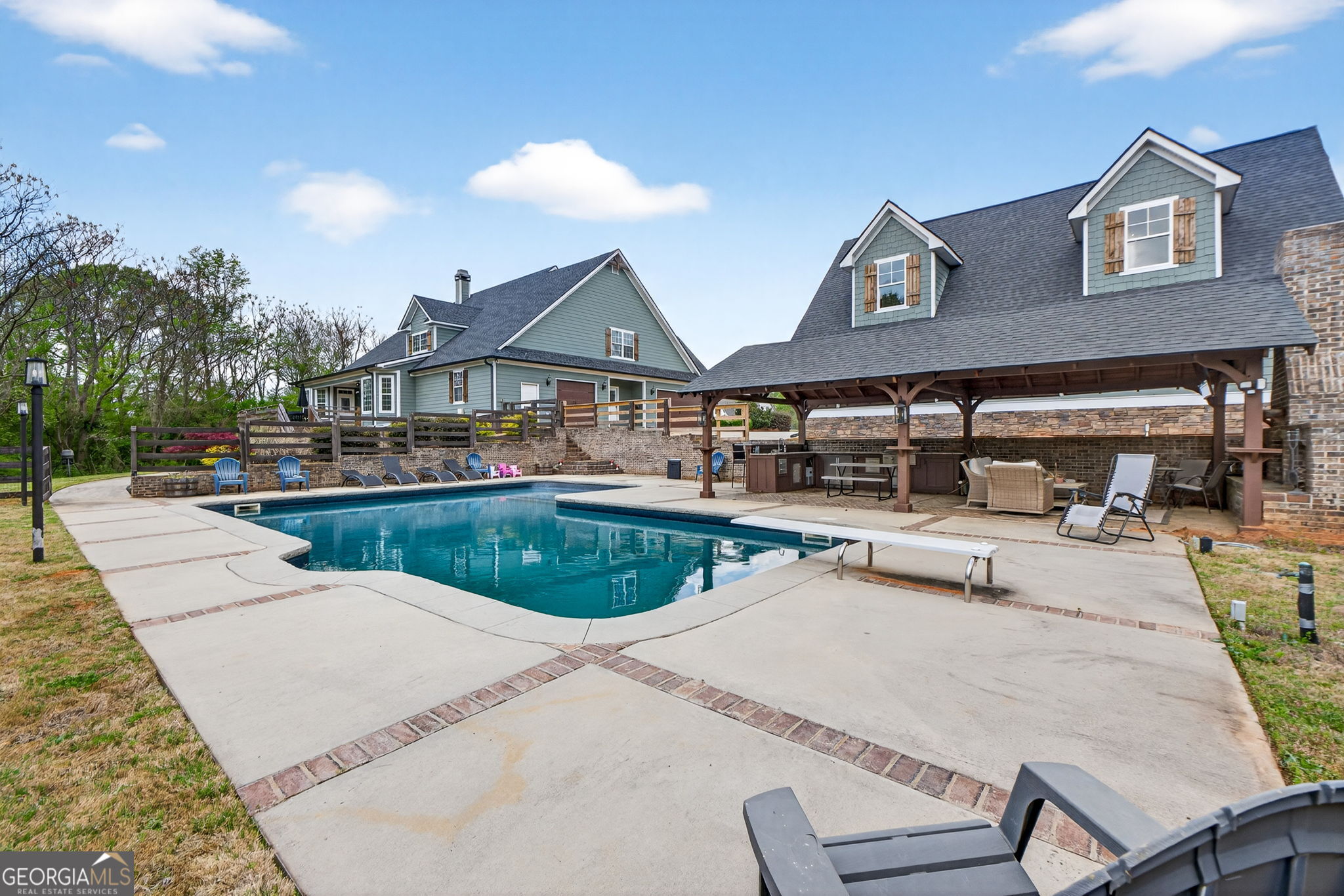 130 Derby Drive Forsyth, GA 31029 - Photo 15 of 97 a swimming pool view with a seating space and a garden view