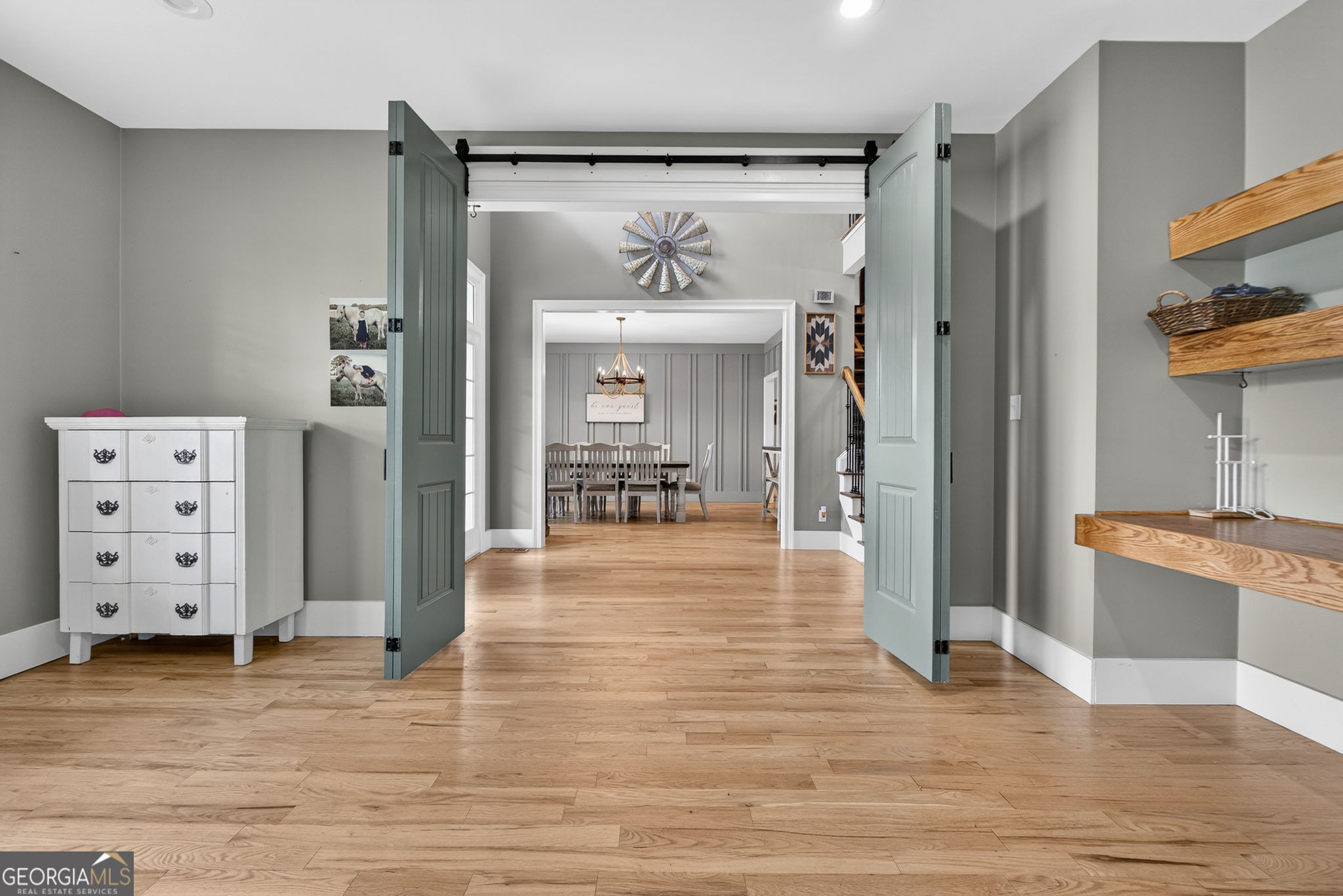 130 Derby Drive Forsyth, GA 31029 - Photo 32 of 97 a view of a hallway view with wooden floor and windows