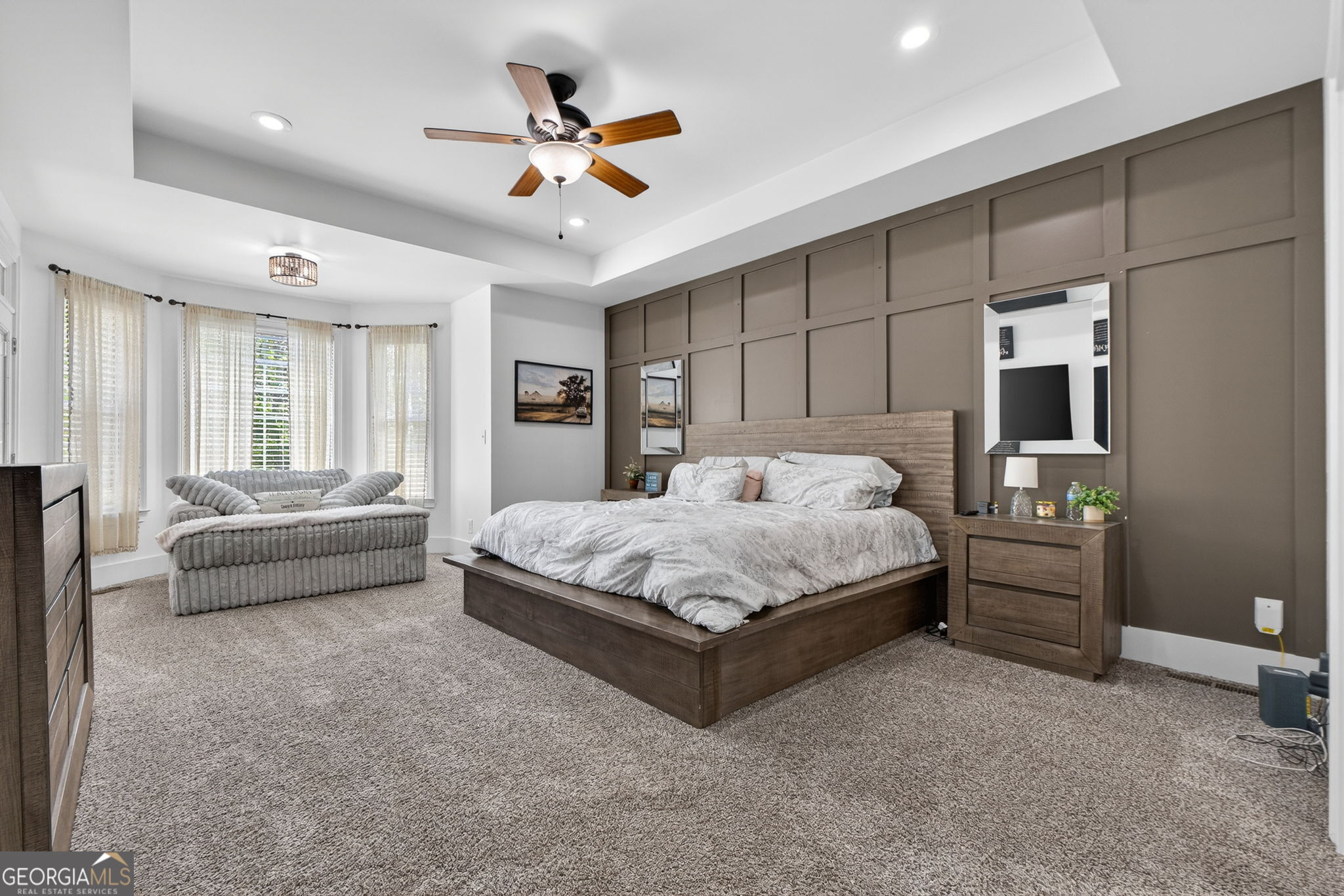130 Derby Drive Forsyth, GA 31029 - Photo 48 of 97 a bedroom with a bed a couch and a ceiling fan