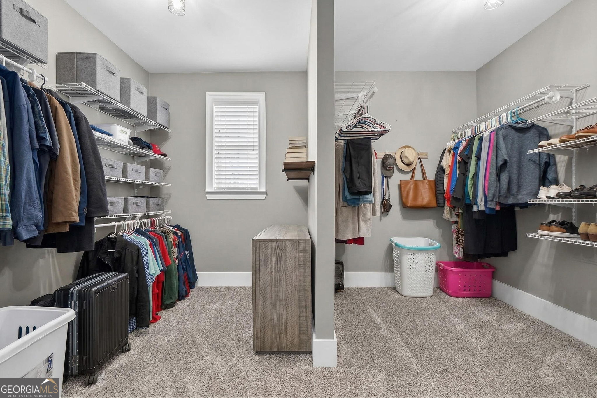 130 Derby Drive Forsyth, GA 31029 - Photo 56 of 97 a view of walk in closet with clothes and shoes