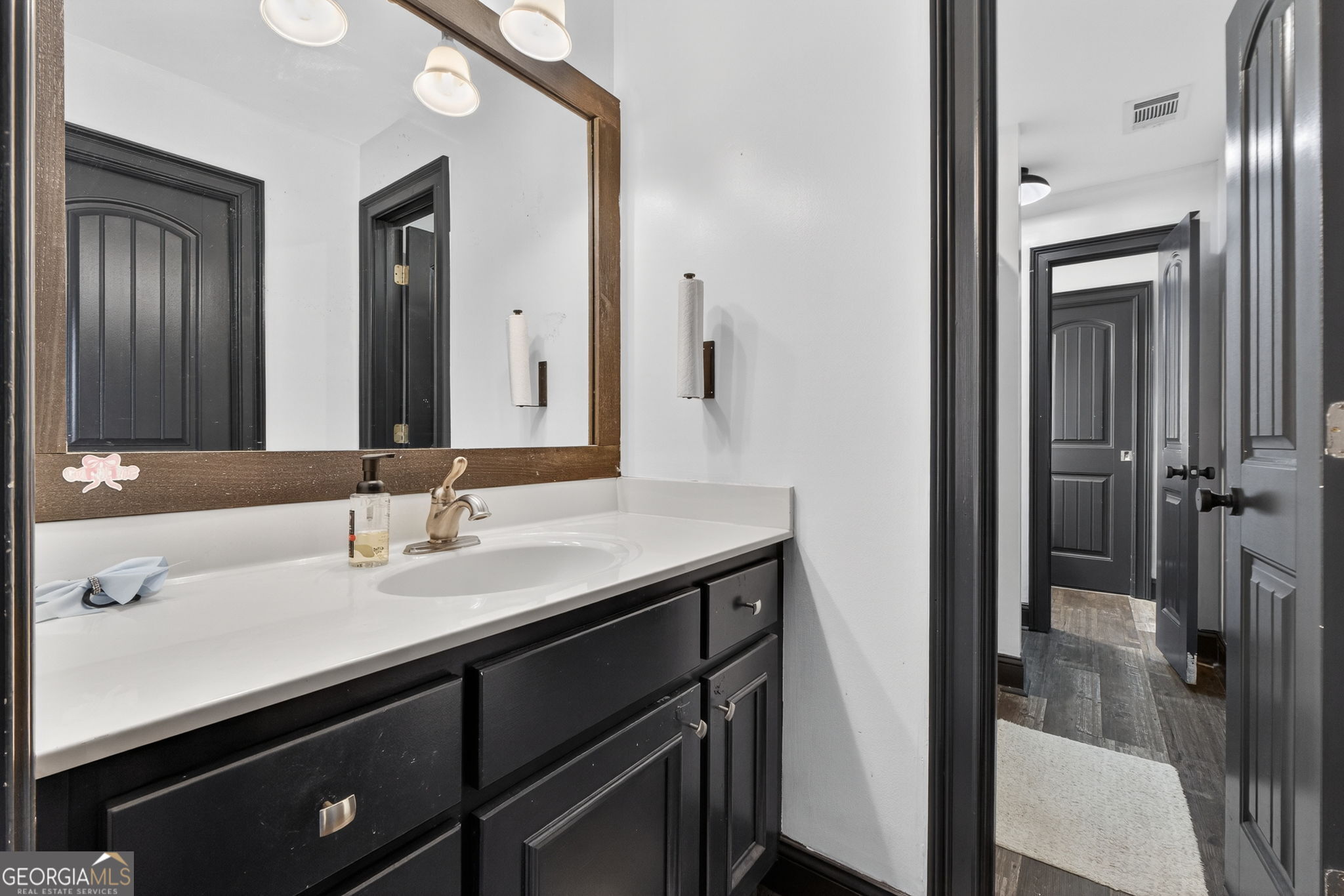 130 Derby Drive Forsyth, GA 31029 - Photo 71 of 97 a bathroom with a sink and a mirror