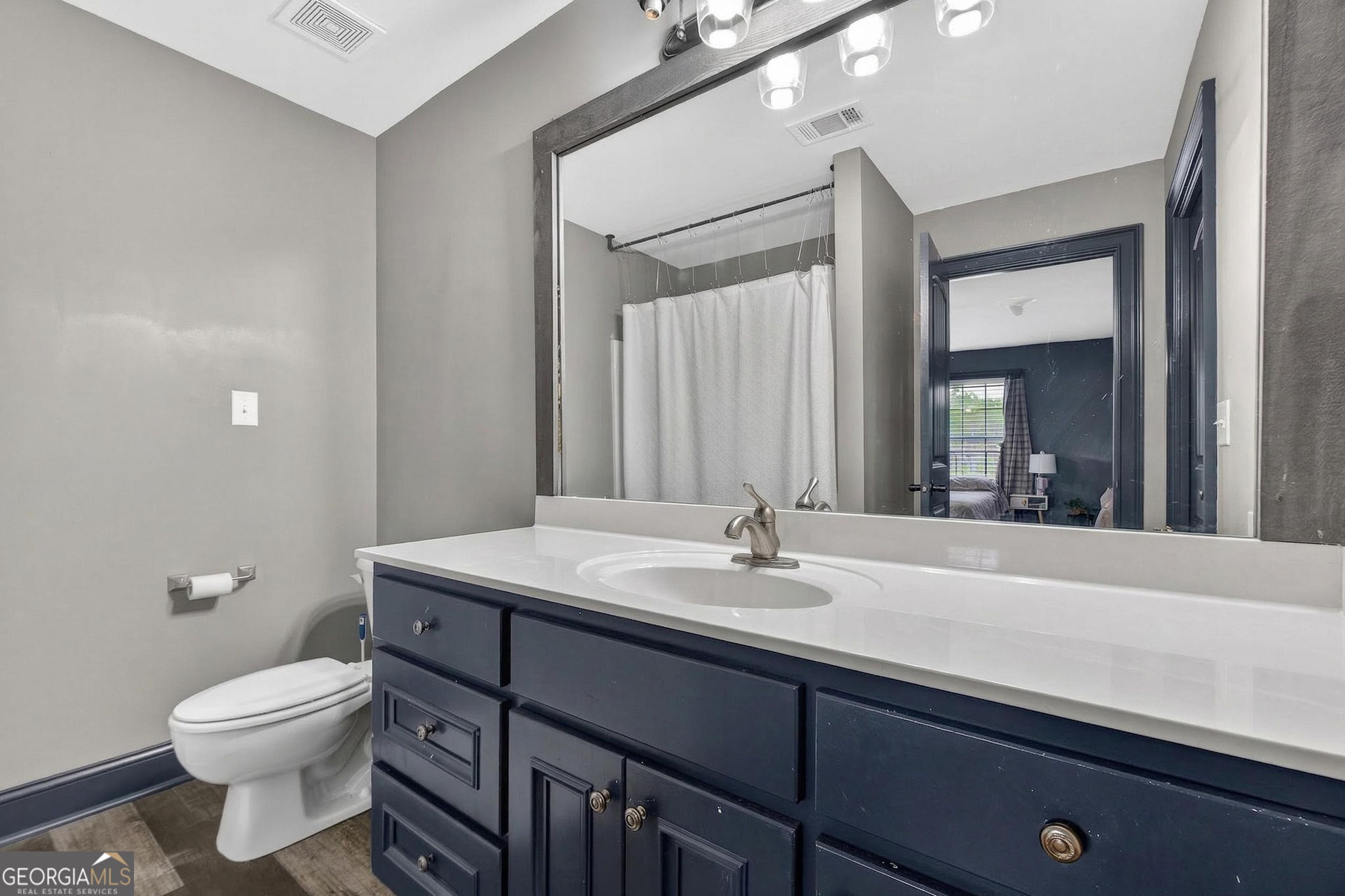 130 Derby Drive Forsyth, GA 31029 - Photo 73 of 97 a bathroom with a sink a toilet and mirror