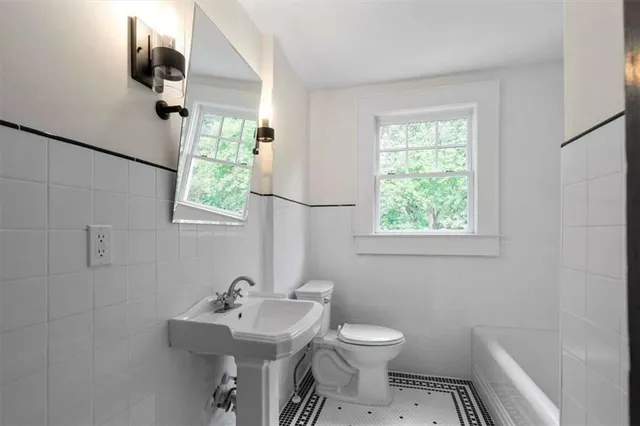 a bathroom with a sink and mirror