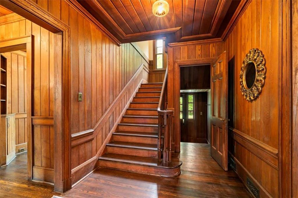 6104 Floyd Street Northeast Covington, GA 30014 - Photo 17 of 53 a view of entryway with wooden floor and stairs